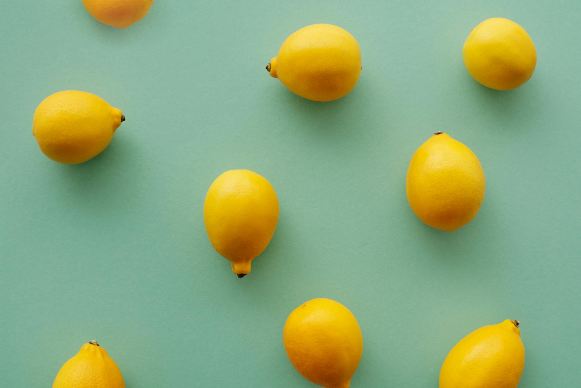 Fresh bright yellow lemons on a pastel background representing renewal and restoration